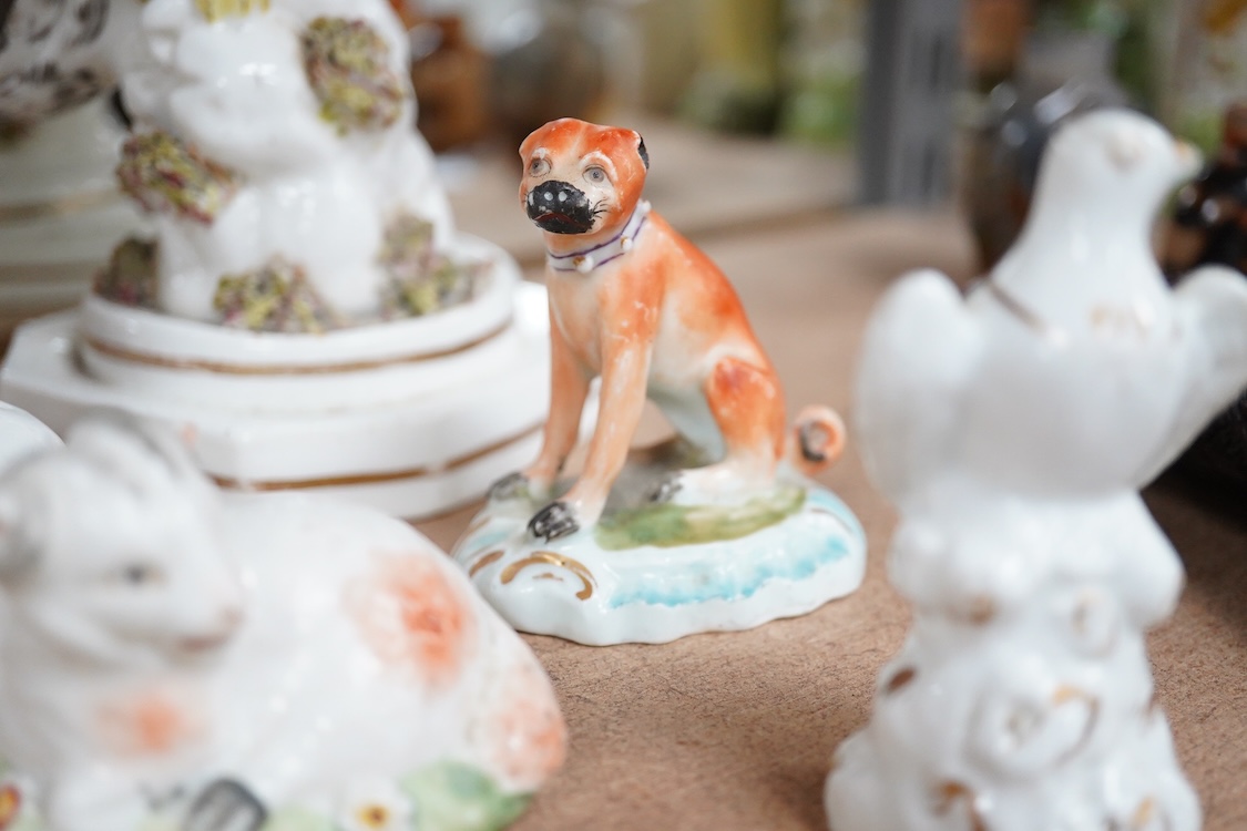 A rare Staffordshire porcelain model of an eagle or vulture, c.1830-50, and five Derby porcelain models, 1810–30; two recumbent sheep, a pug dog, a deer and a dove, 20cm high
